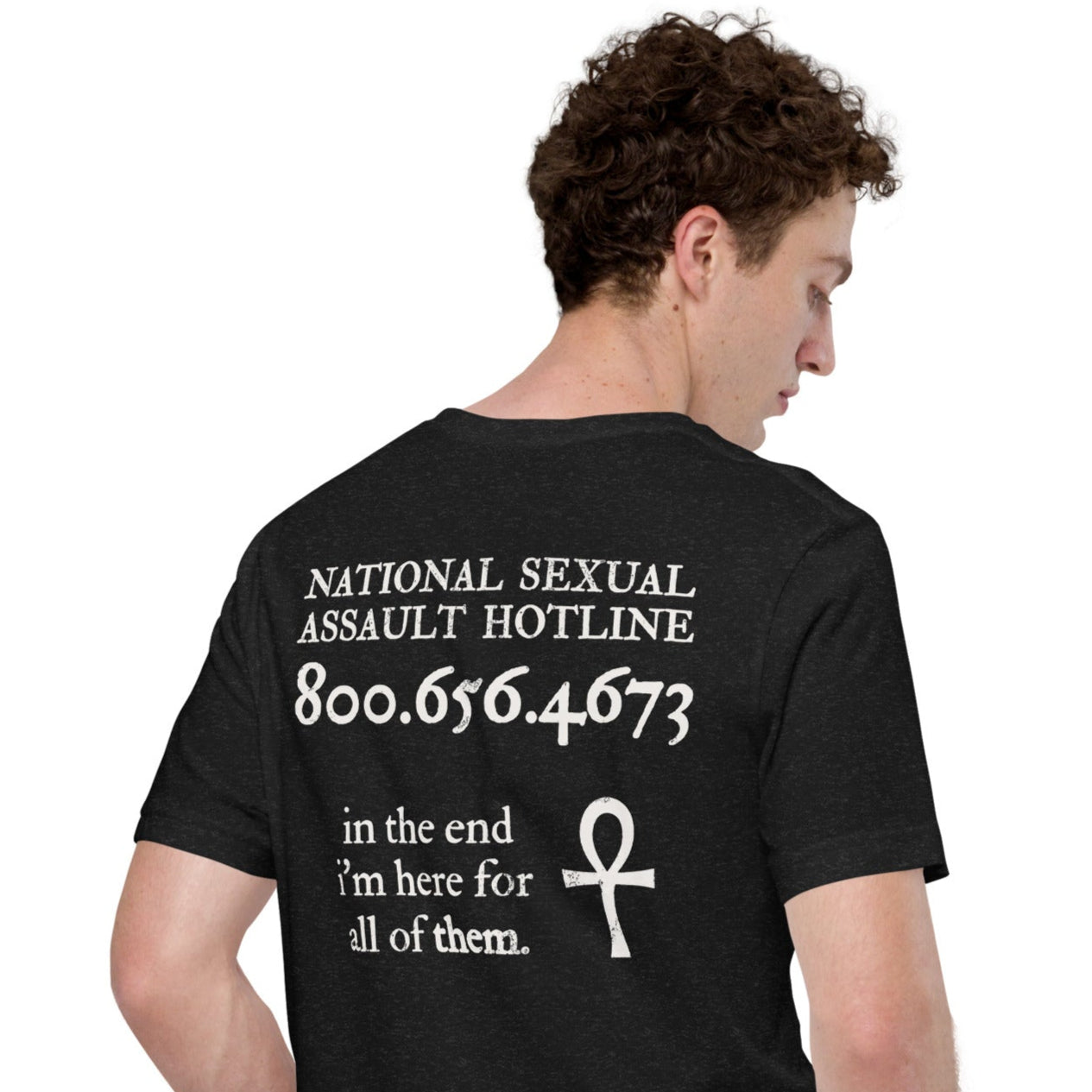 Male model wearing Trust the Story t-shirt — back view with Death quote and hotline design.