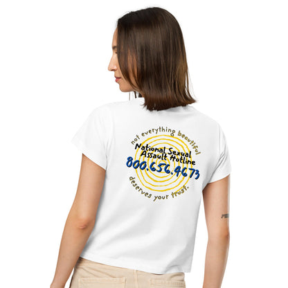 Female model wearing Not Everything Beautiful high-waisted t-shirt  back view with hotline text and spiral portal.
